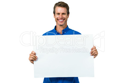 Smiling man holding board