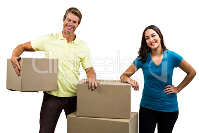 Portrait of happy couple with boxes