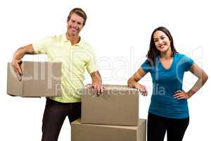 Portrait of happy couple with boxes