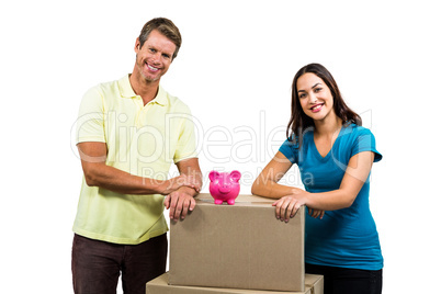 Portrait of smiling couple with boxes