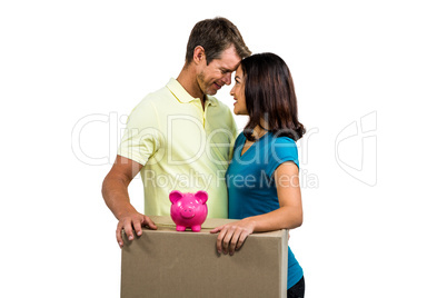 Couple with box standing close to each other
