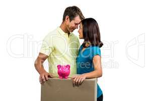 Couple with box standing close to each other