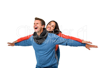 Happy couple with arms outstretched