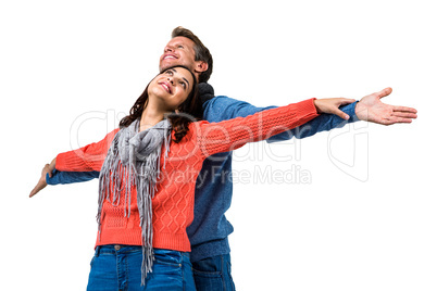 Couple with arms outstretched