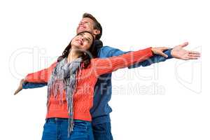 Couple with arms outstretched