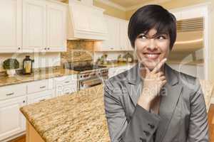 Mixed Race Woman Looking Back Over Shoulder Inside Custom Kitche
