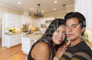 Hispanic Couple Inside Custom Kitchen Interior