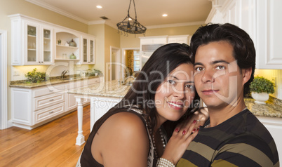 Hispanic Couple Inside Custom Kitchen Interior