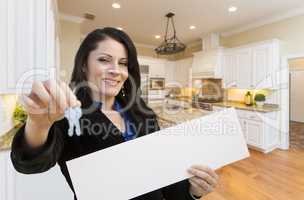 Hispanic Woman In Kitchen Holding House Keys and Blank Sign