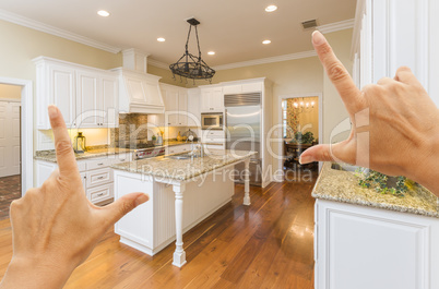 Hands Framing A Beautiful Custom Kitchen