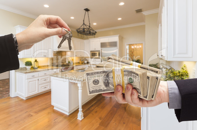 Handing Over Cash for Keys Inside Beautiful Kitchen