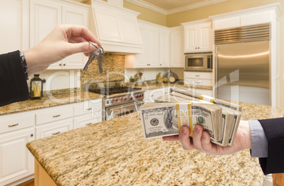 Handing Over Cash for Keys Inside Beautiful Kitchen