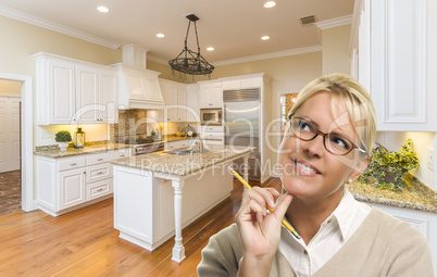 Daydreaming Woman with Pencil Inside Beautiful Custom Kitchen