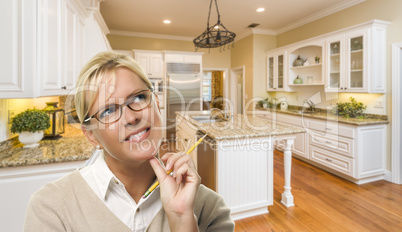 Daydreaming Woman with Pencil Inside Beautiful Custom Kitchen