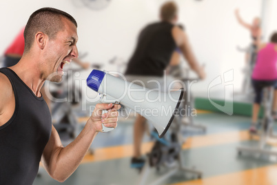 Composite image of irritated male trainer yelling through megaph