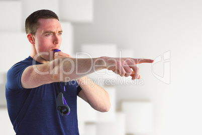 Composite image of trainer blowing whistle