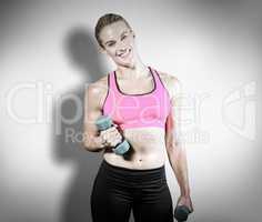 Composite image of muscular woman lifting heavy dumbbells