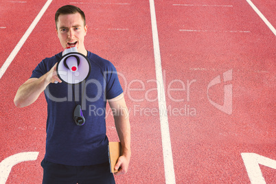 Composite image of attentive trainer looking at the camera