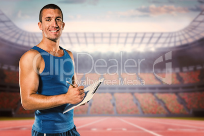 Composite image of portrait of confident sports coach writing on