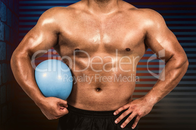 Composite image of muscular man with weight ball