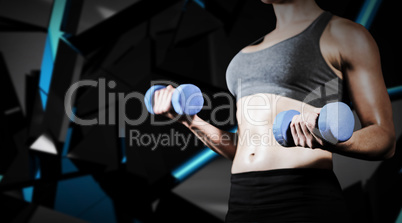 Composite image of muscular woman lifting heavy dumbbells