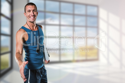 Composite image of happy personal trainer giving handshake