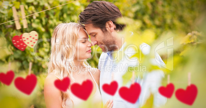 Composite image of young romantic couple embracing each other