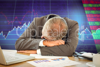 Composite image of tired businessman resting on desk