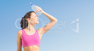 Composite image of fit woman with water