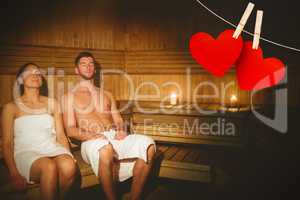 Composite image of couple together in the sauna
