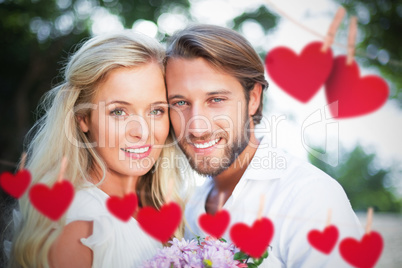 Composite image of couple smiling at the camera