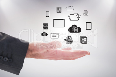 Composite image of businessman holding hand out in presentation