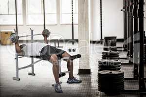 Composite image of fit man exercising with barbell