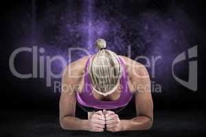 Composite image of muscular woman doing push ups