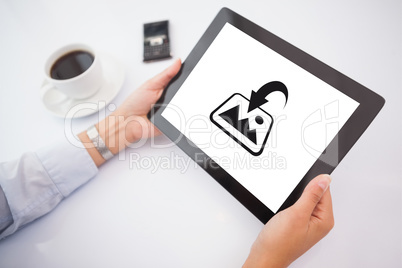 Composite image of man using tablet pc