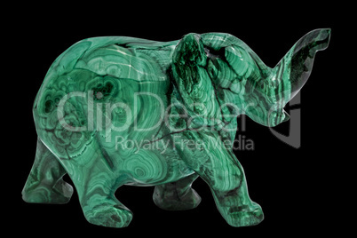 Elephant figurine from malachite, isolated on black background,