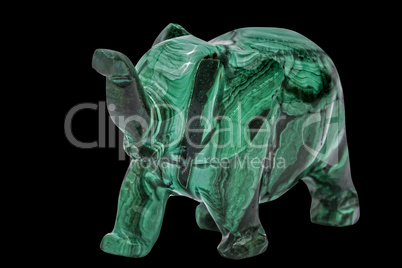 Elephant figurine from malachite, isolated on black background,