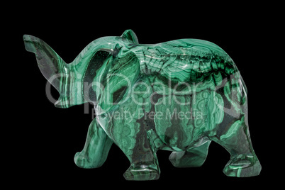 Elephant figurine from malachite, isolated on black background,