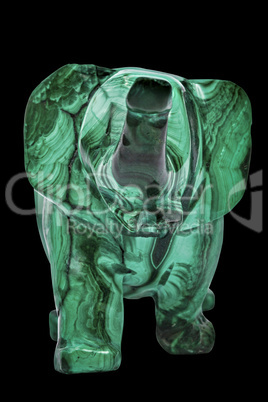 Elephant figurine from malachite, isolated on black background,