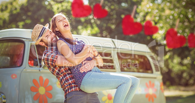 Composite image of hipster couple having fun together