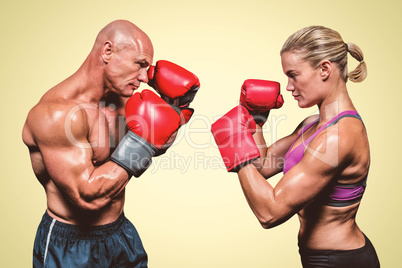 Composite image of side view of boxers with fighting stance