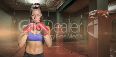 Composite image of portrait of pretty woman with fighting stance