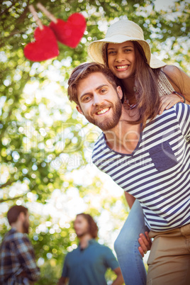 Composite image of hipster couple having fun together