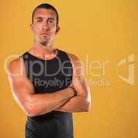 Composite image of confident athlete with arms crossed