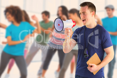 Composite image of male trainer yelling through the megaphone