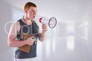 Composite image of angry personal trainer yelling through megaph