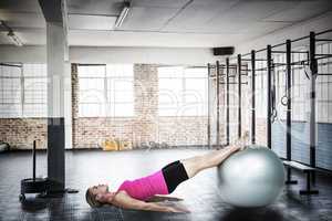 Composite image of woman doing pilates