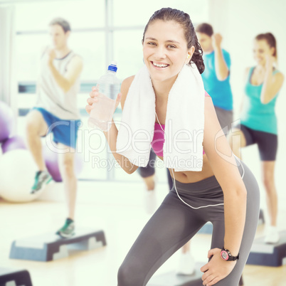 Composite image of fit woman with water