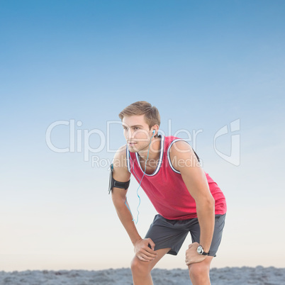 Composite image of fit man taking break