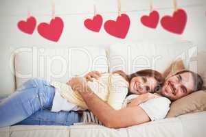 Composite image of cute couple relaxing on couch